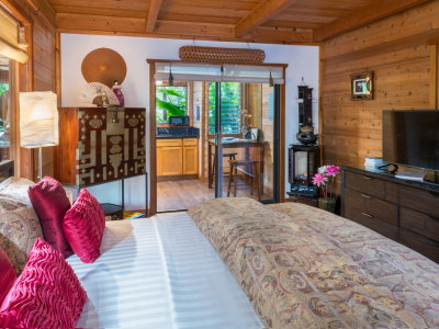 Image of king bed with garden view at Lotus Garden Cottages in Volcano Hawaii