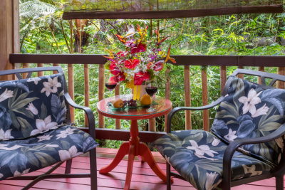 Image of chairs on private lanai at Lotus Garden Cottages in Volcano Hawaii