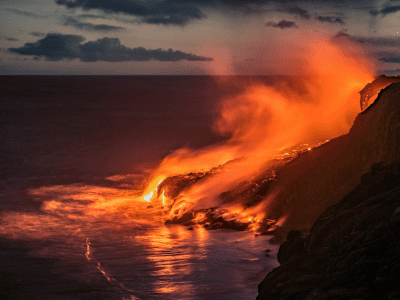 Spectacular evening view of the lava from the Kilauea volcano, flowing in the Pacific ocean near Kalapana on the south coast of the Big Island of Hawa